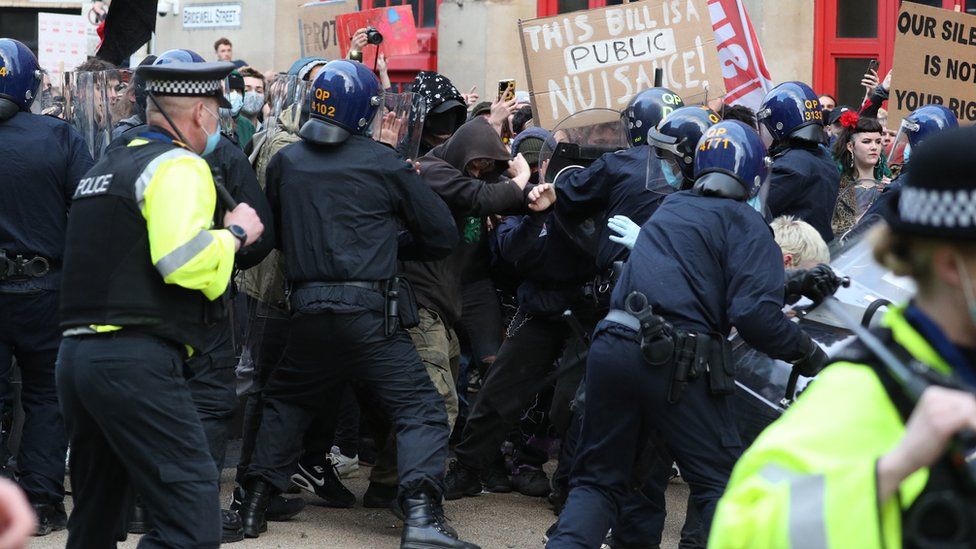 Police and the front line of protestors clashing